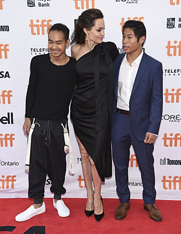 Mandatory Credit: Photo by Invision/AP/REX/Shutterstock (9050674aa) Maddox Jolie-Pitt, Angelina Jolie, Pax Jolie-Pitt. Maddox Jolie-Pitt, from left, Angelina Jolie and Pax Jolie-Pitt attend a premiere for "First They Killed My Father" on day 5 of the Toronto International Film Festival at the Princess of Wales Theatre, in Toronto 2017 TIFF - "First They Killed My Father" Premiere, Toronto, Canada - 11 Sep 2017 