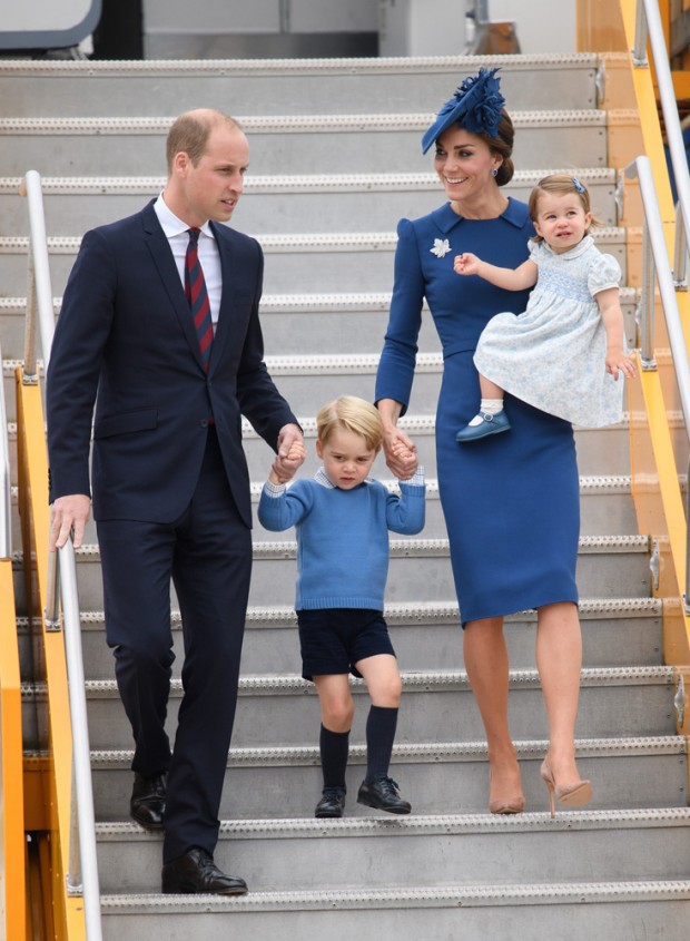 Mandatory Credit: Photo by Tim Rooke/REX/Shutterstock (6012932as) Prince William, Prince George, Catherine Duchess of Cambridge and Princess Charlotte of Cambridge -  official welcome at British Columbia Parliament buildings, Victoria The Duke and Duchess of Cambridge visit Canada - 24 Sep 2016 Hundreds of well-wishers, waving British flags and holding bouquets of flowers lined the airport route to welcome the royals. Prince William emerged from the Airbus at about 4 pm holding hands with blond-haired Prince George. The young Prince was wearing dark blue shorts with a light blue sweater. Princess Kate, wearing a blue dress and blue hat, carried Princess Charlotte in her arms. The youngest princess hugged her mother close. Her brownish hair included a blue barret. The royal couple was greeted first on the Tarmac by Governor General David Johnston and his wife. Followed by Prime Minister Justin Trudeau and his wife, Sophie Gregoire Trudeau. Also on the Tarmac was British Columbia's Lt.-Gov. Judith Guichon. B.C. Premier Christy Clark and her son, Hamish were also on the Tarmac. The welcoming ceremony was 10 minutes. Prince George waved several times during the arrival. The royals waved to well-wishers from their motorcade vehicle 